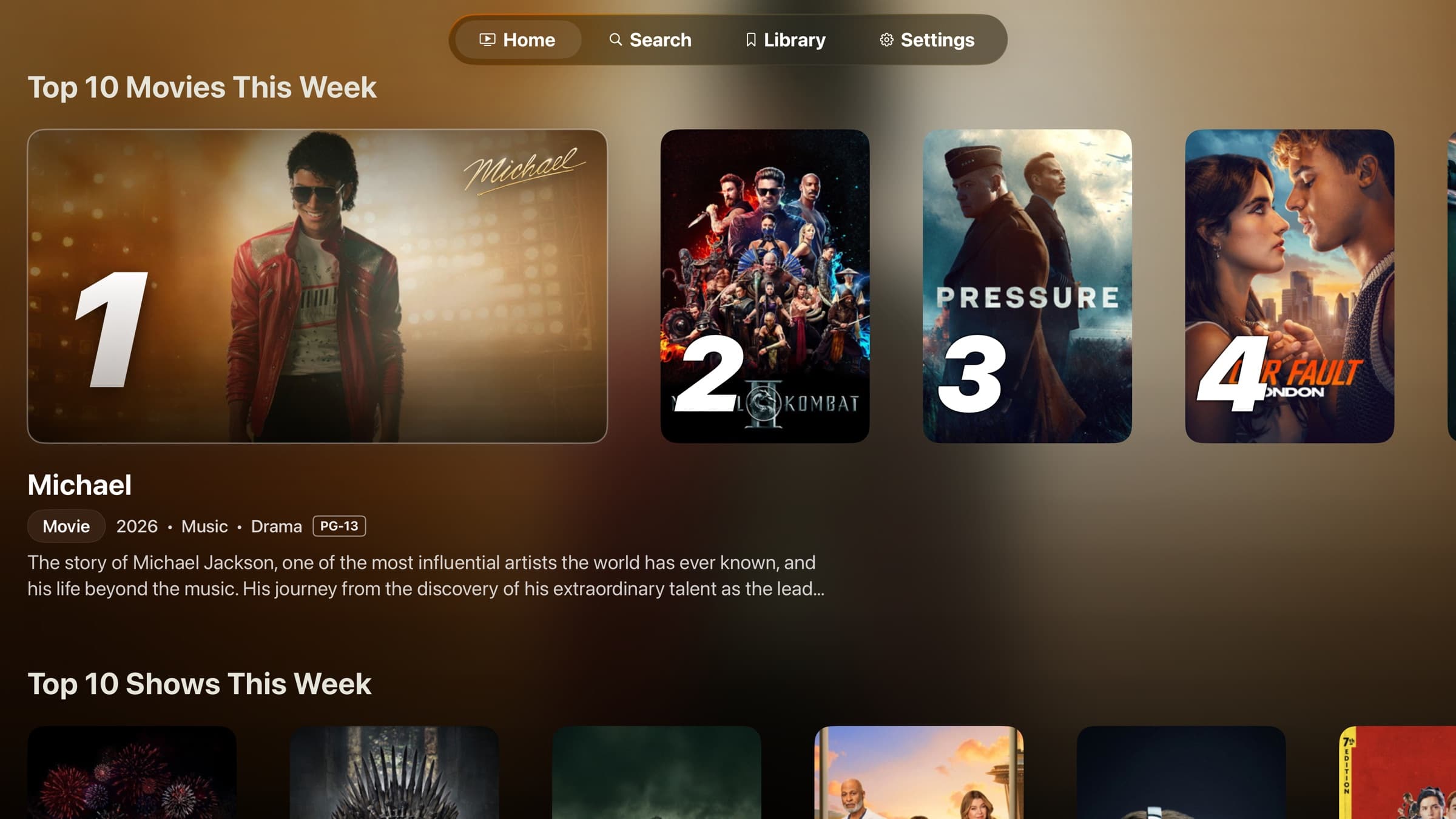 The Atlas home screen on Apple TV: a Top 10 Movies spotlight row with the focused title's details below it, and a Top 10 Shows row underneath.